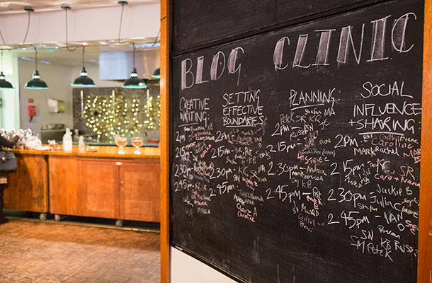 Image of white board with blogging clinics listed.