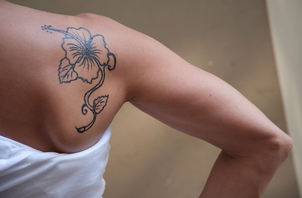 Image of feame shoulder blade displaying tattoo.