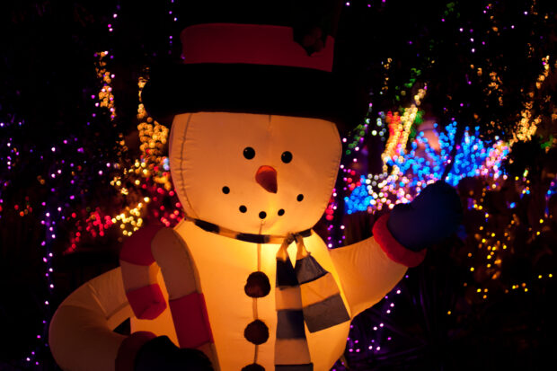 illuminated inflatable snow man with Christmas lights