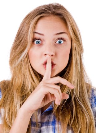 Woman with finger on lip to say shhh