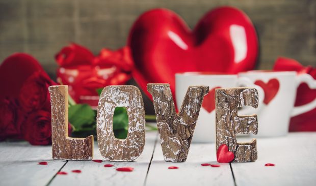 Love wooden letters on rustic background