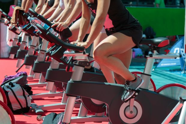 Group of Boys and Girls at Gym: Workout with Spinning Bikes