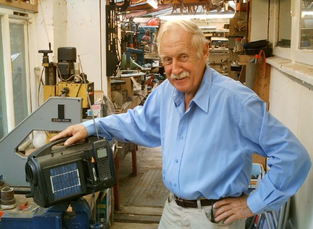 Trevor in his workshop with his clockwork radio