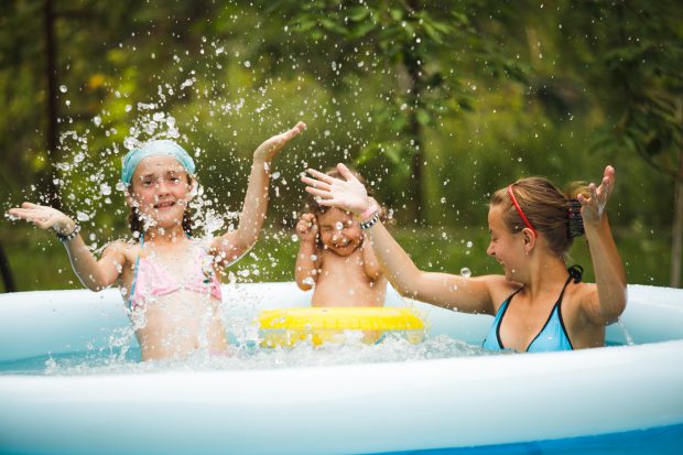 Girls splashing in swimming pool