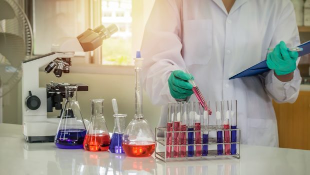 scientist with equipment in laboratory