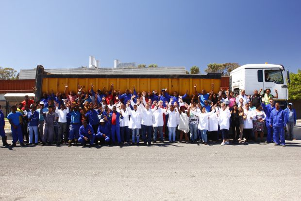 The winners celebrating next to an Agriprotein lorry