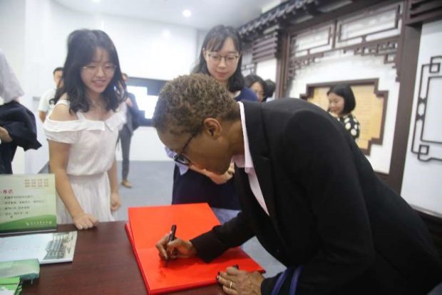 Signing museum visitors book at Zhongnan University of Economics and Law 