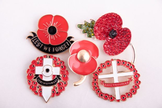 A collection of counterfeit poppy broaches 