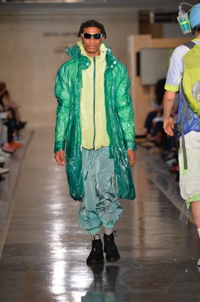 Male model on catwalk wearing colourful outfit designed by Randa Kherba