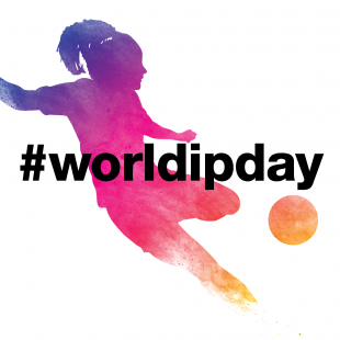 Shadow of woman kicking a ball with the hashtag worldipday