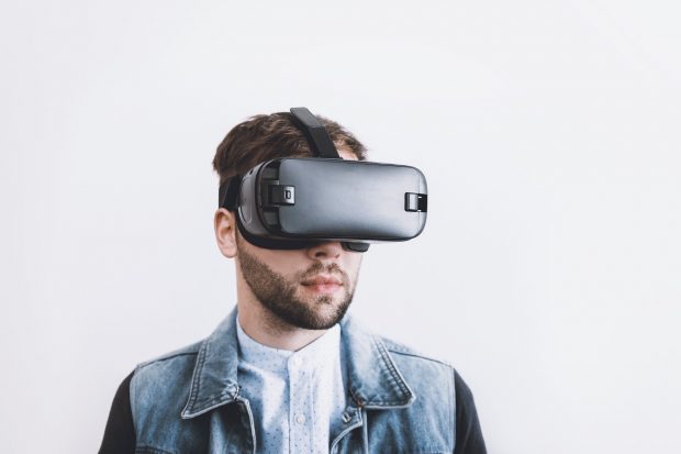 Young man wearing virtual reality headset