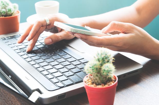 Owner of small or medium sized enterprise working at a laptop computer