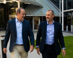 IPO CEO Adam Williams (left) walking with former CEO Tim Moss (right) as they handover