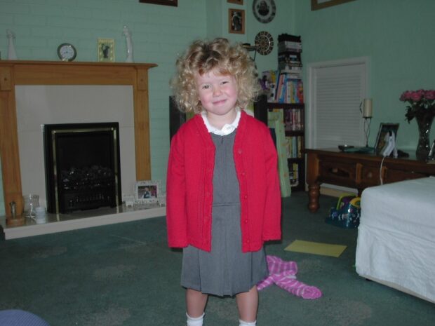 An image of Meg on her first day of school with unruly hair