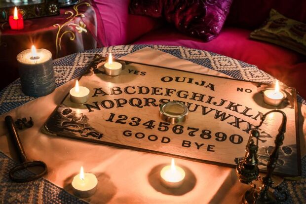 Spiritism table with a Ouija board.