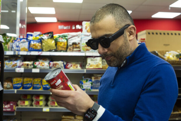 Mavis Technology CEO and founder David Sikharulidze demonstrating how his smart glasses help him to navigate the world around him and support him with food shopping.
