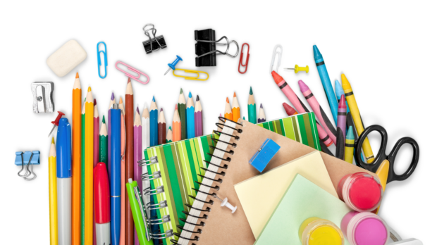 Colourful school supplies on white background.
