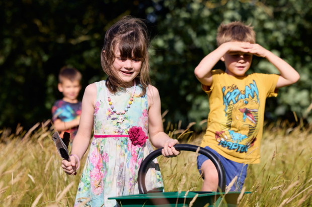 Children with basket collecting produce